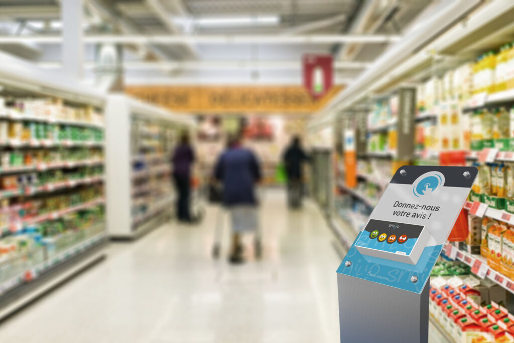 Borne de satisfaction 4 smiley dans un magasin